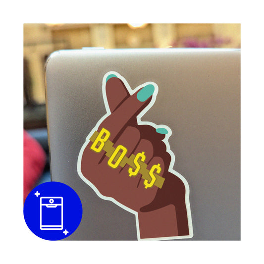 Cool sticker of hands doing heart sign. Green finger nail polish. Wears four rings that spell out "BOSS"